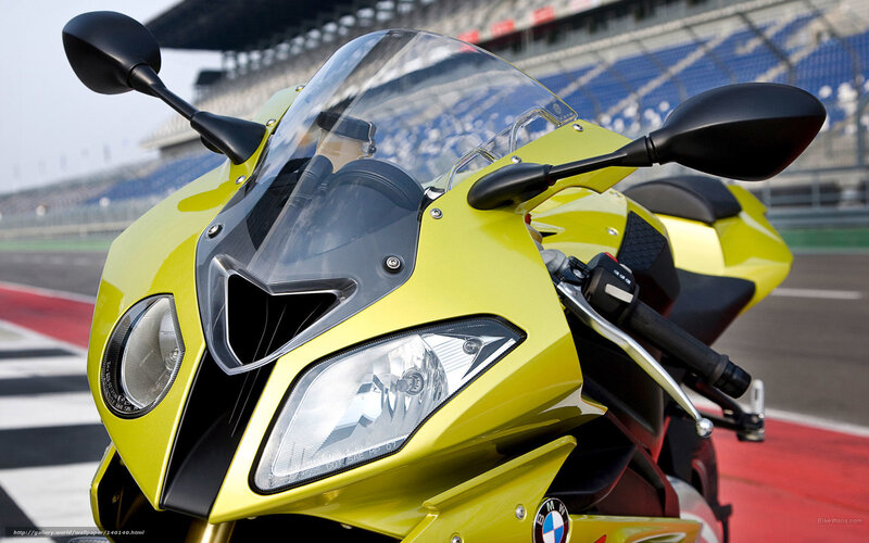 Yellow BMW motorcycle on racetrack