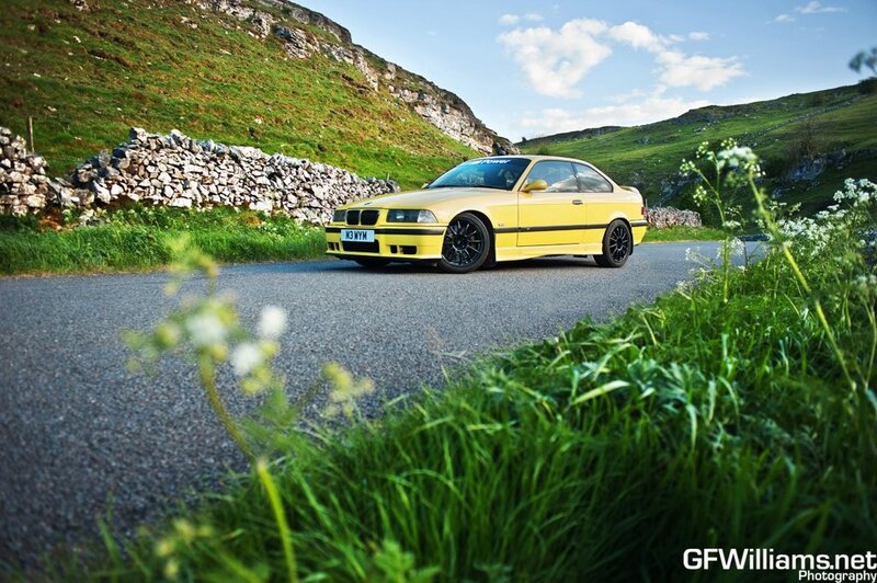 Yellow BMW on a country road