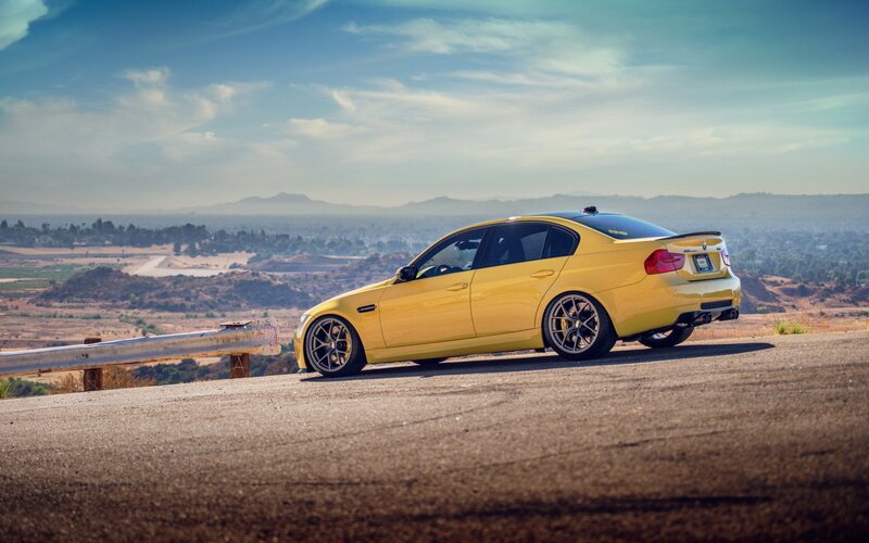 Yellow BMW on a scenic overlook