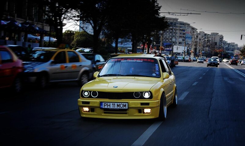 yellow bmw on city street