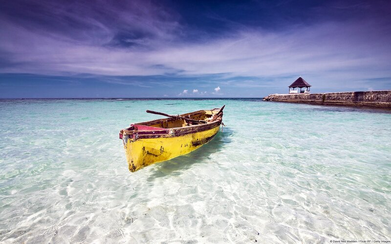 Yellow boat in clear water
