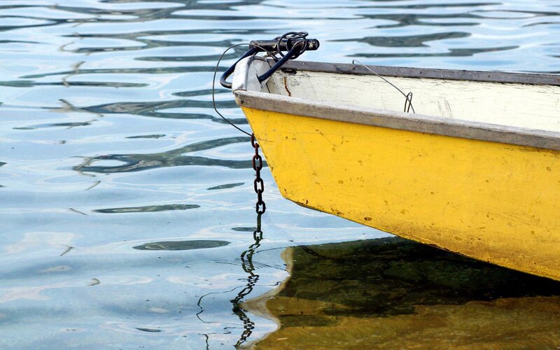 yellow boat on calm water