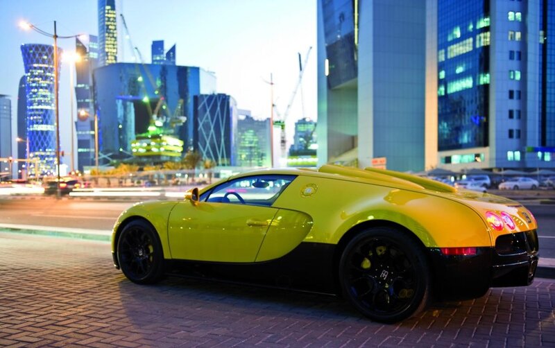 yellow bugatti in city
