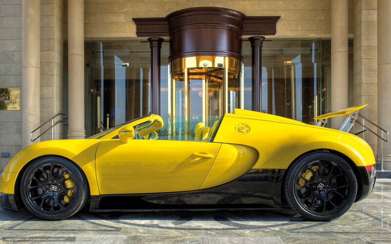 Yellow Bugatti Veyron at hotel entrance
