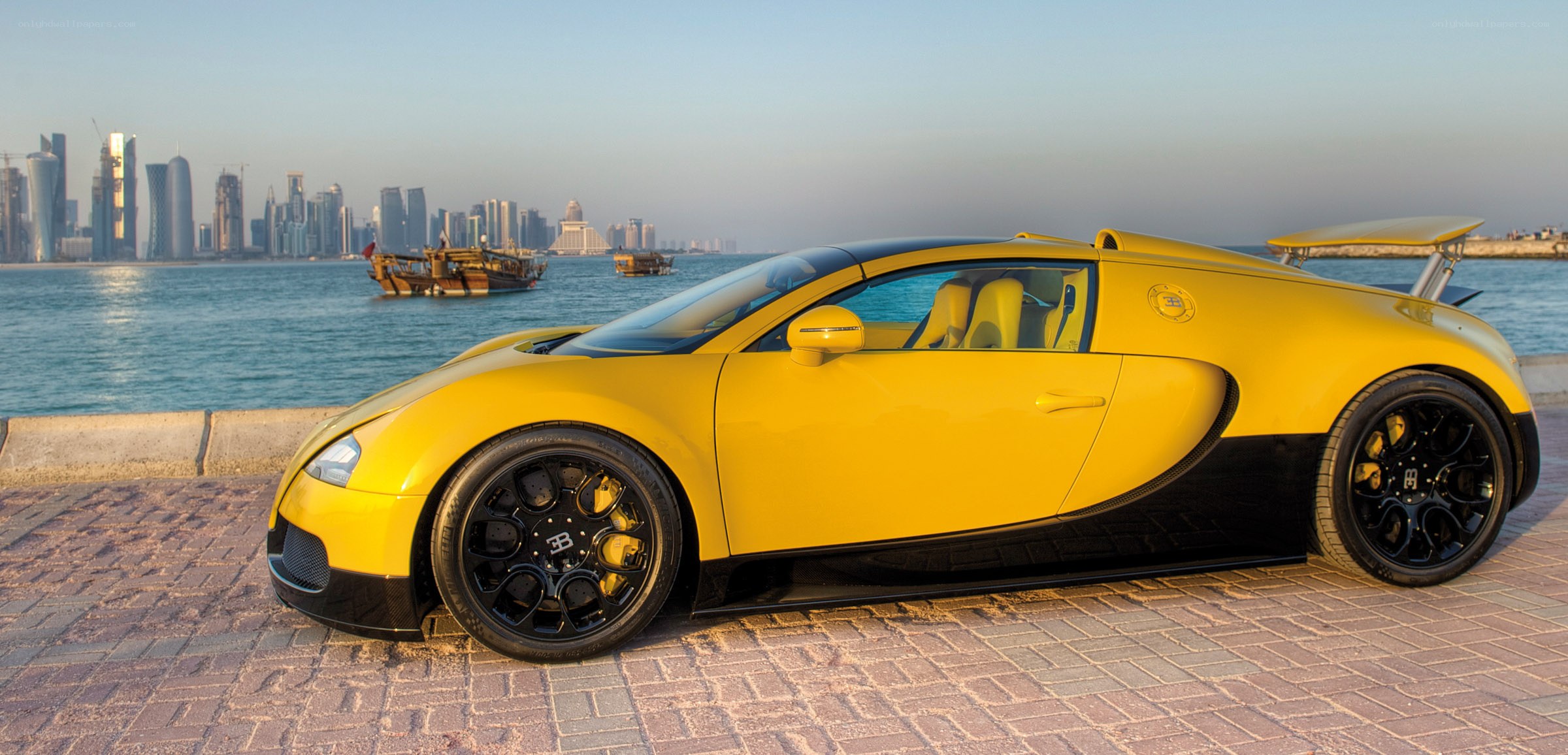 Yellow Bugatti Veyron by the sea