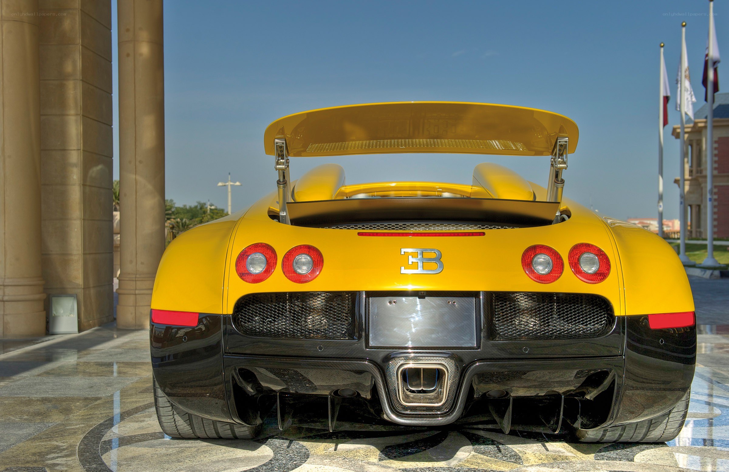 Yellow Bugatti Veyron rear view