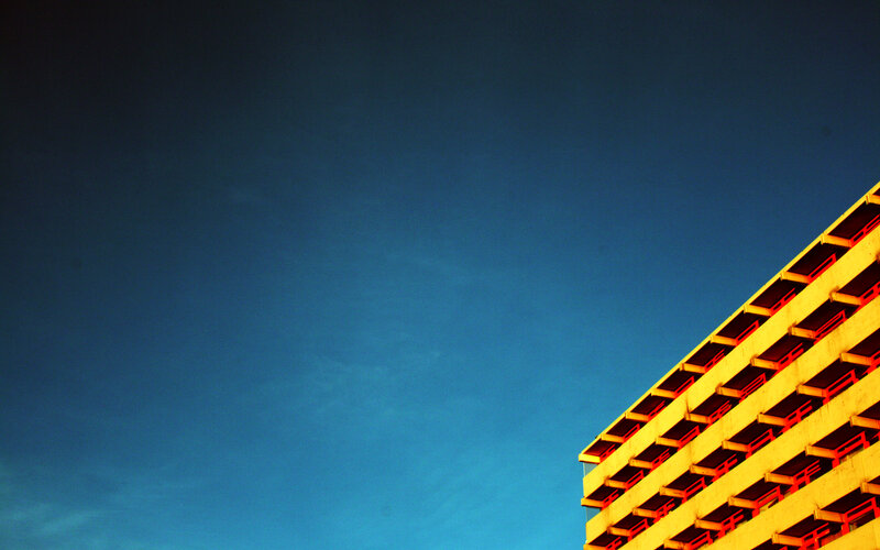 yellow building against blue sky