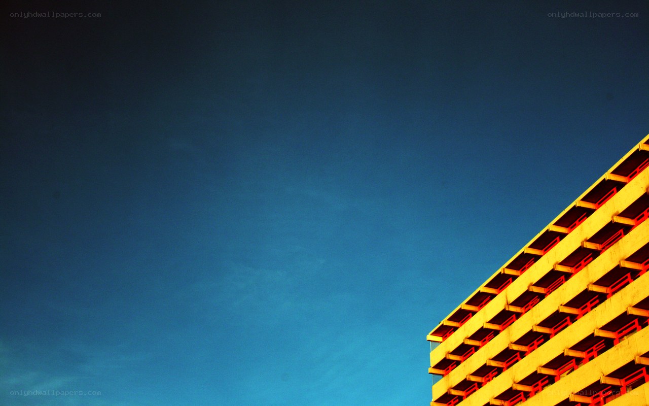 yellow building against blue sky