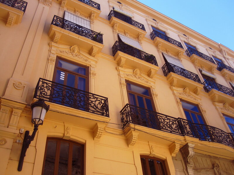 Yellow Building Facade — Serene, Afternoon