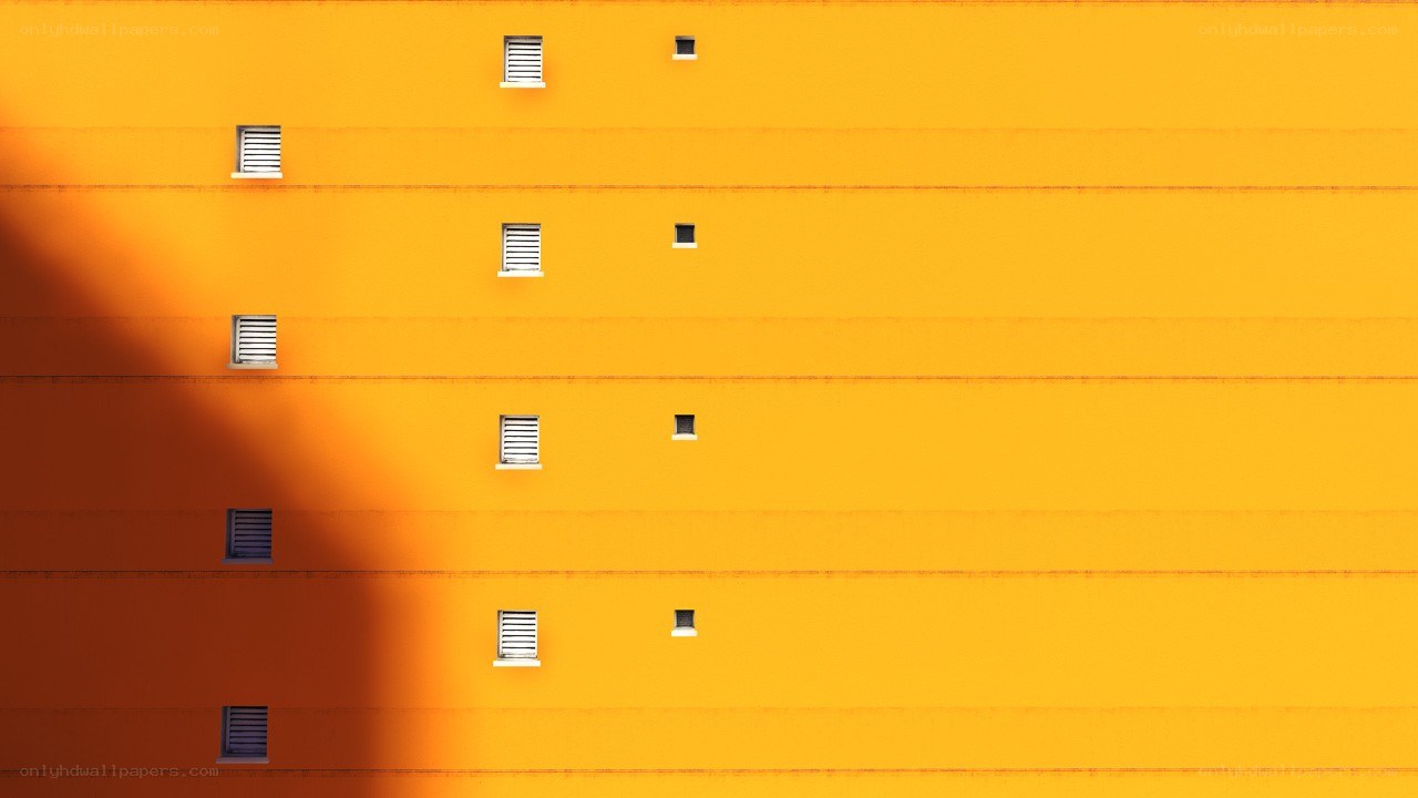 Yellow building facade with windows