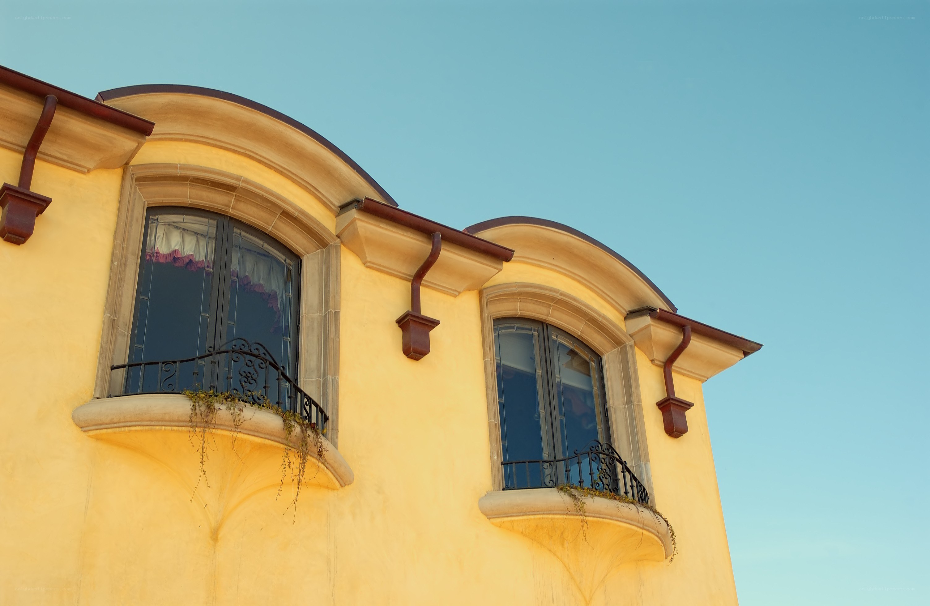 yellow building with arched windows