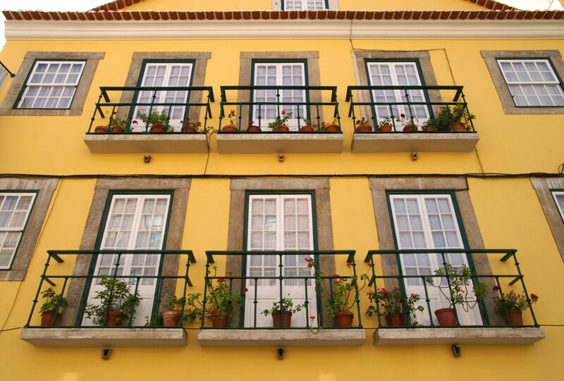 yellow building with balconies