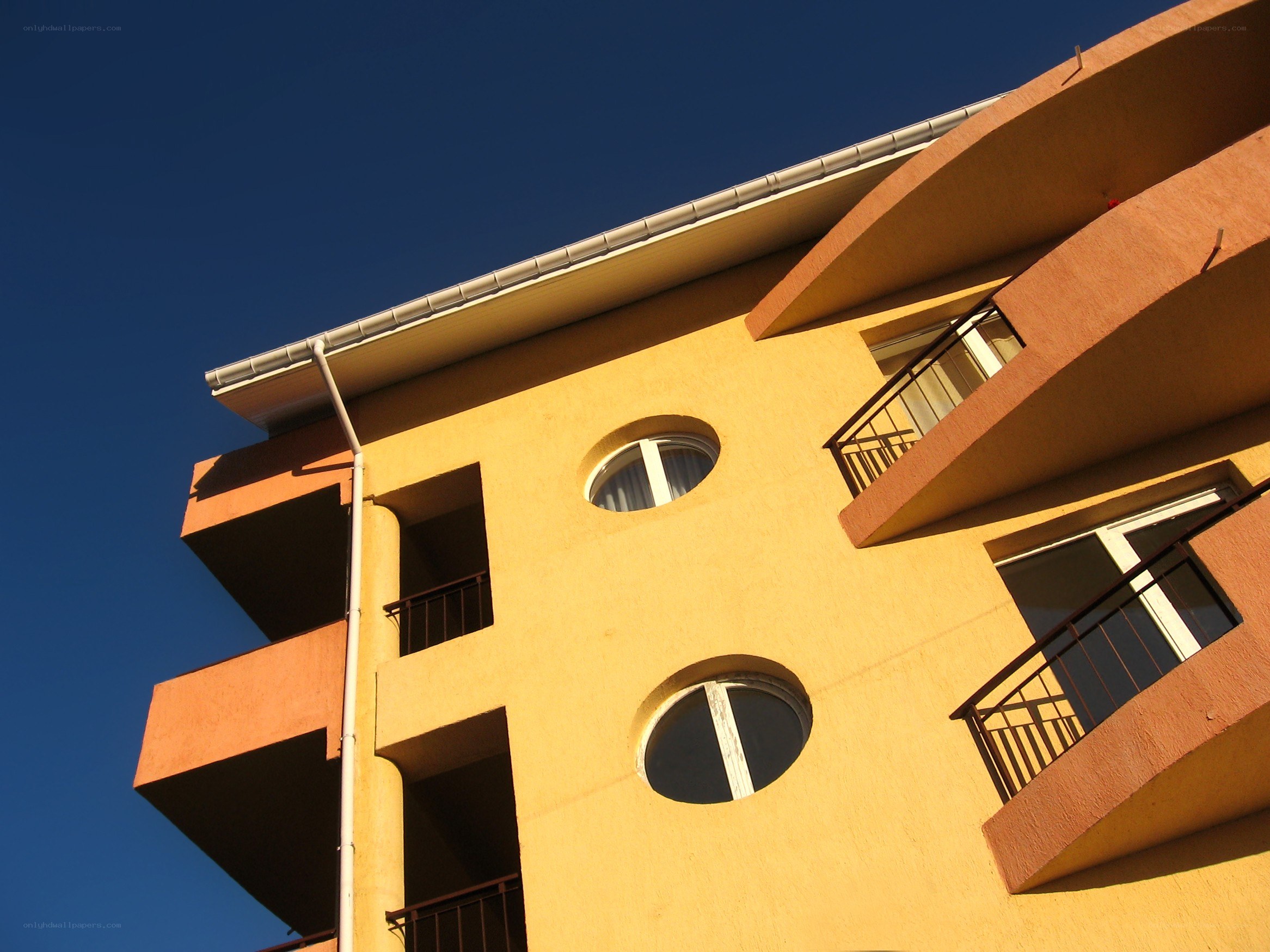 yellow building with balconies