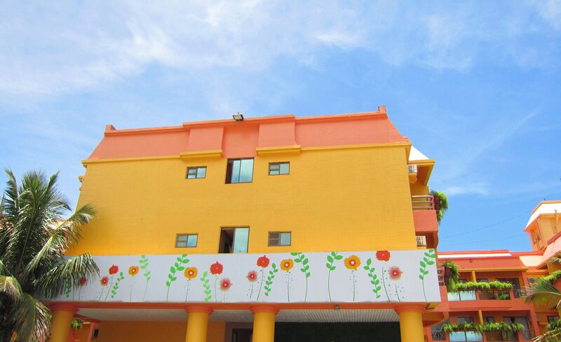 Yellow Building with Flowers