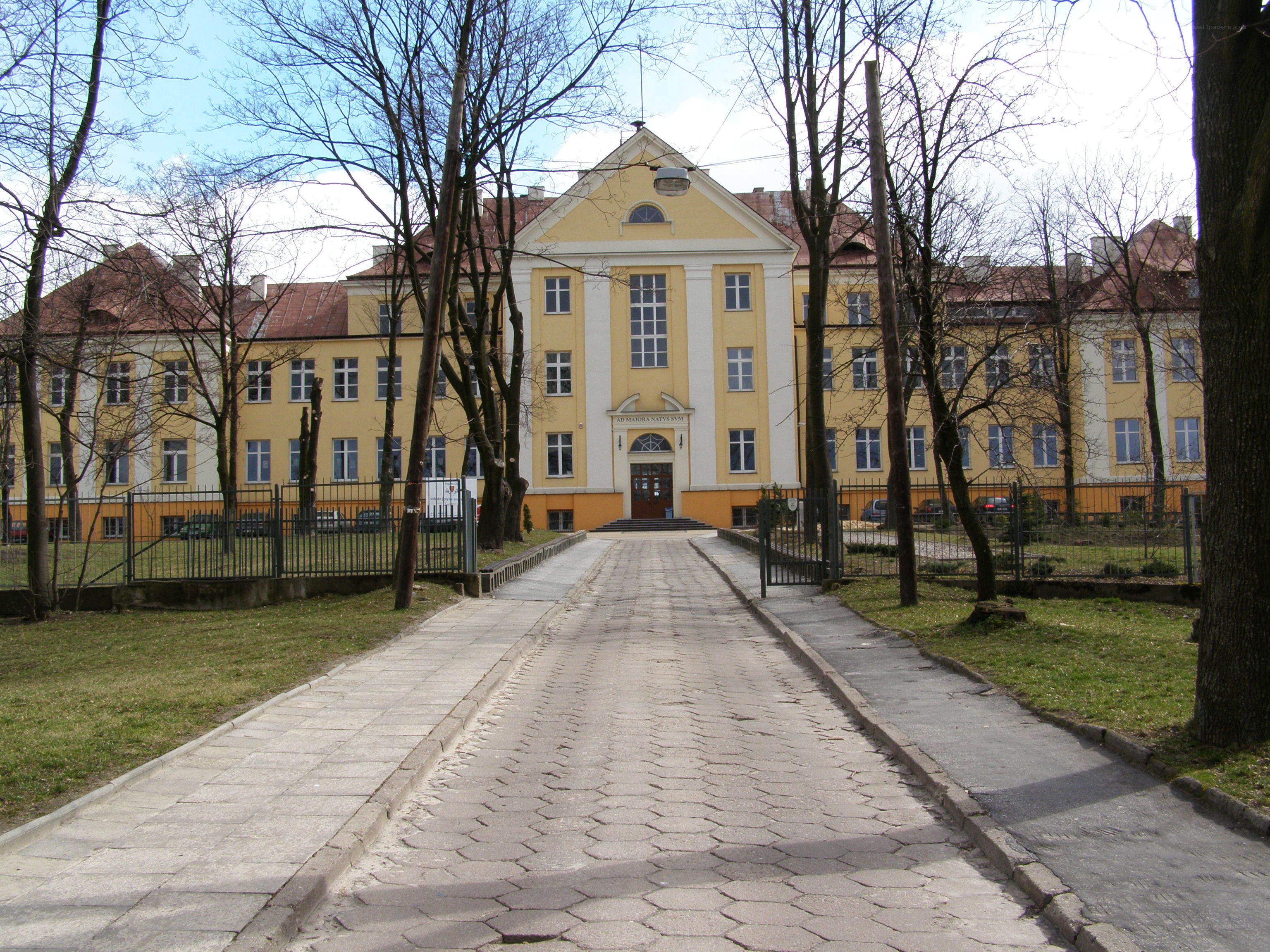 yellow building with paved walkway