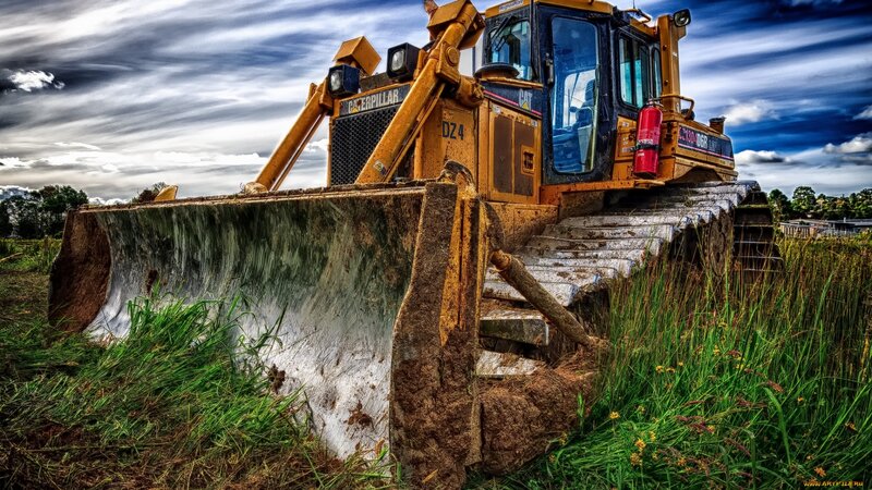 Yellow Bulldozer in Field — Dramatic