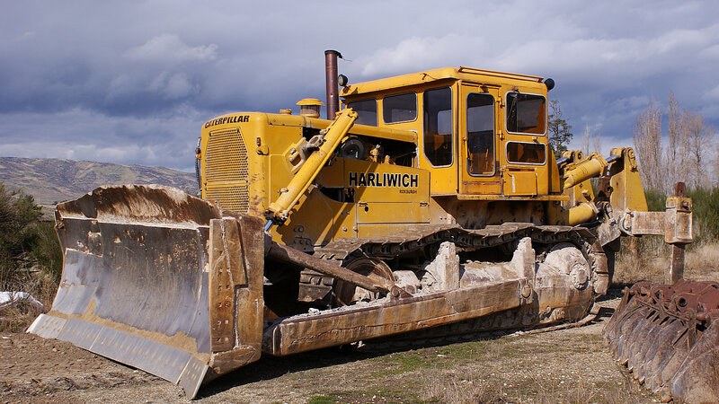 Yellow bulldozer in field