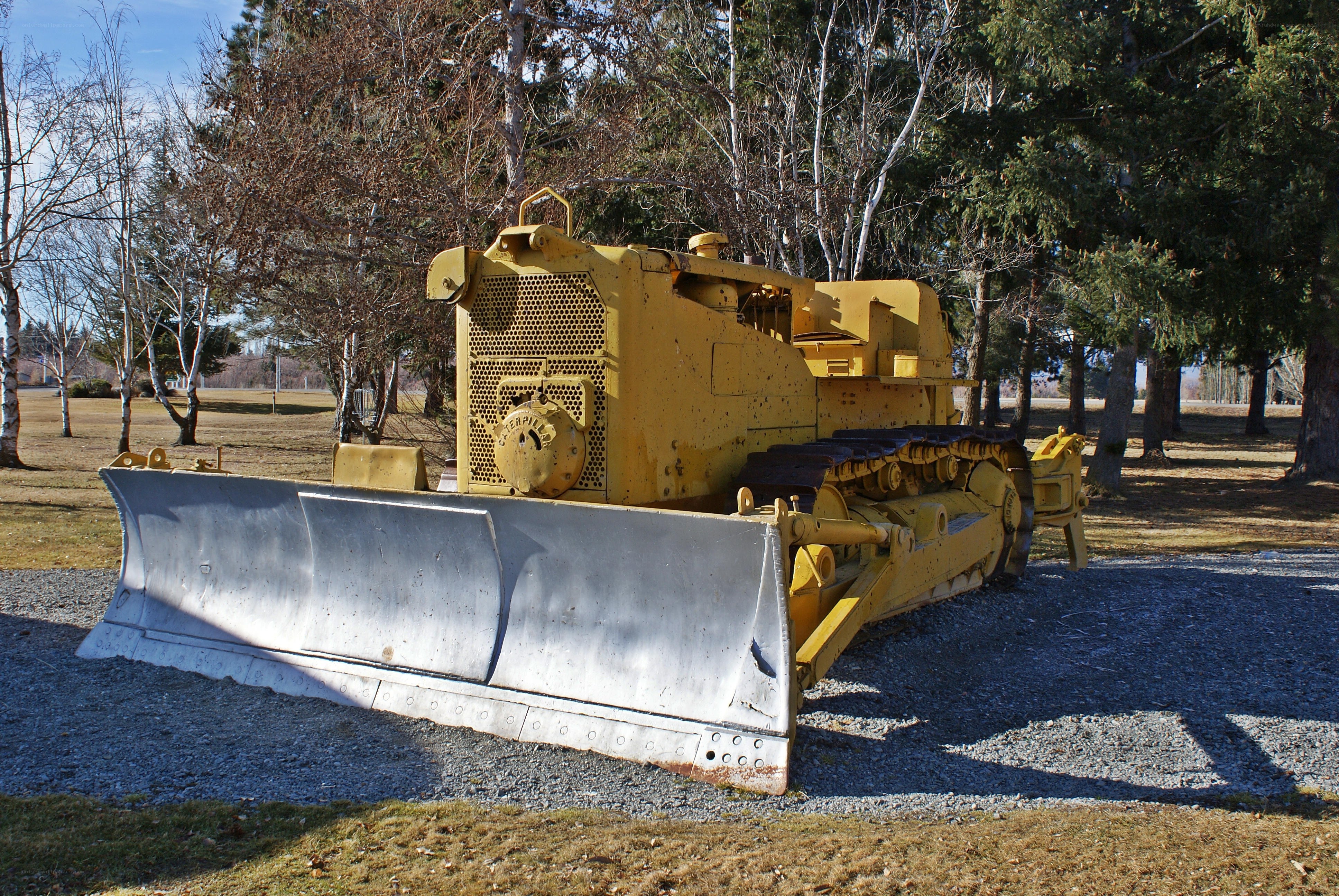 Yellow bulldozer in park