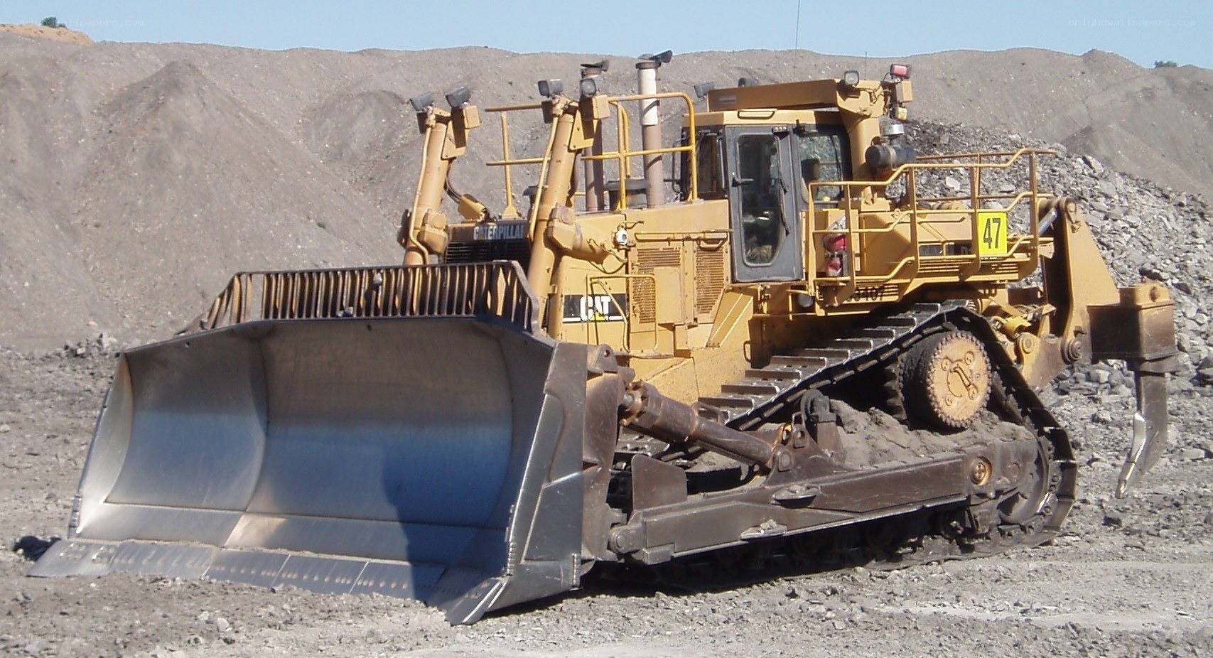Yellow bulldozer in quarry