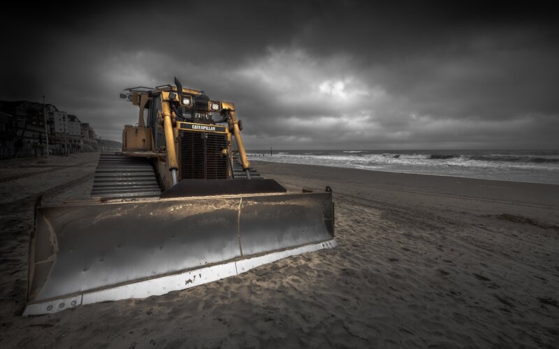 Yellow Bulldozer on Beach