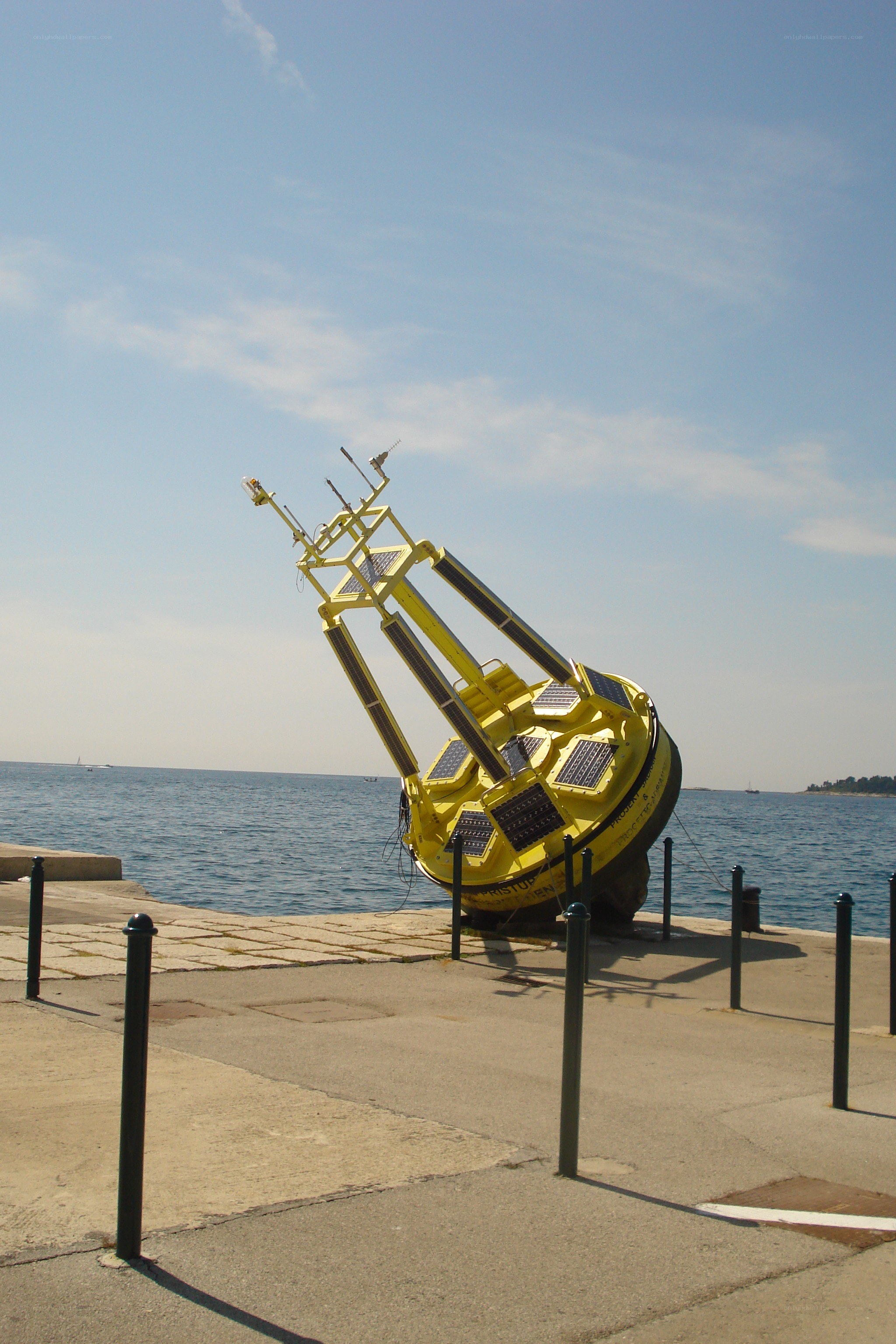 Yellow buoy on a pier