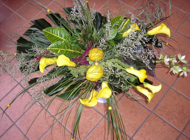 Yellow calla lilies and greenery arrangement