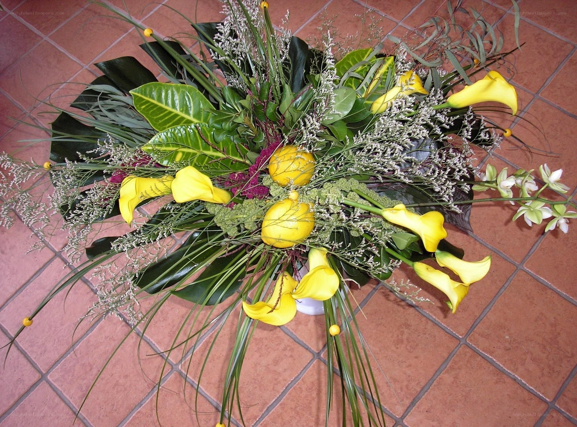 Yellow calla lilies and greenery arrangement