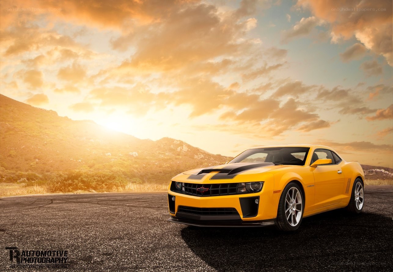 Yellow Camaro at sunset