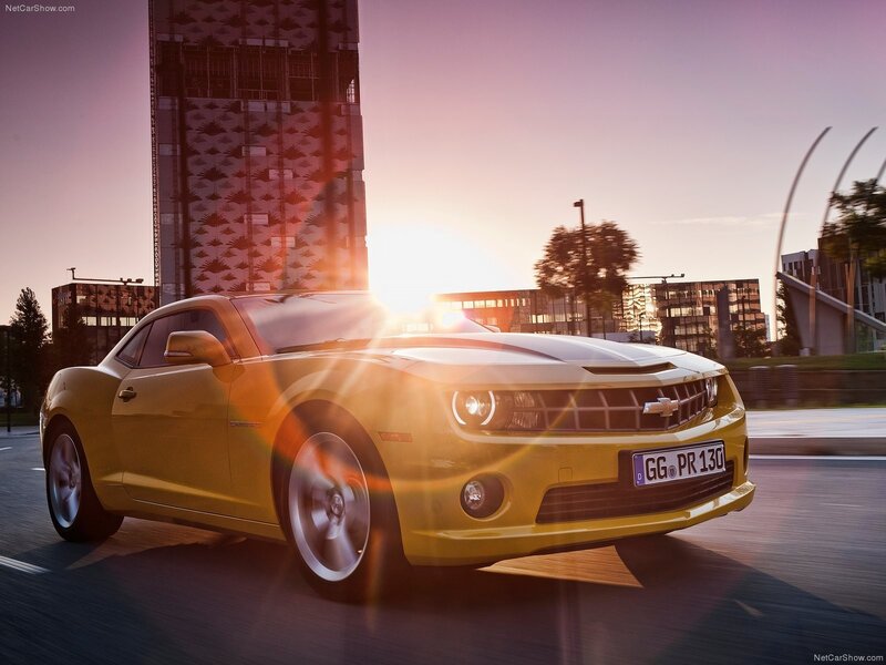 Yellow Camaro at sunset