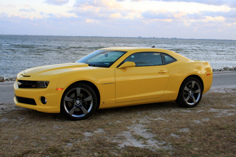 Yellow Camaro by the water