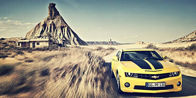Yellow Camaro Car — Dramatic, Afternoon, Photograph, Rock Formation, Desert, Building