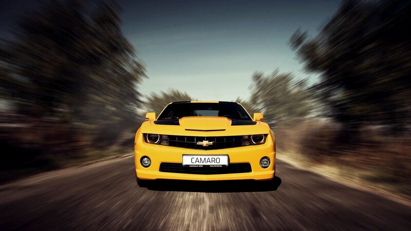 Yellow Camaro in motion