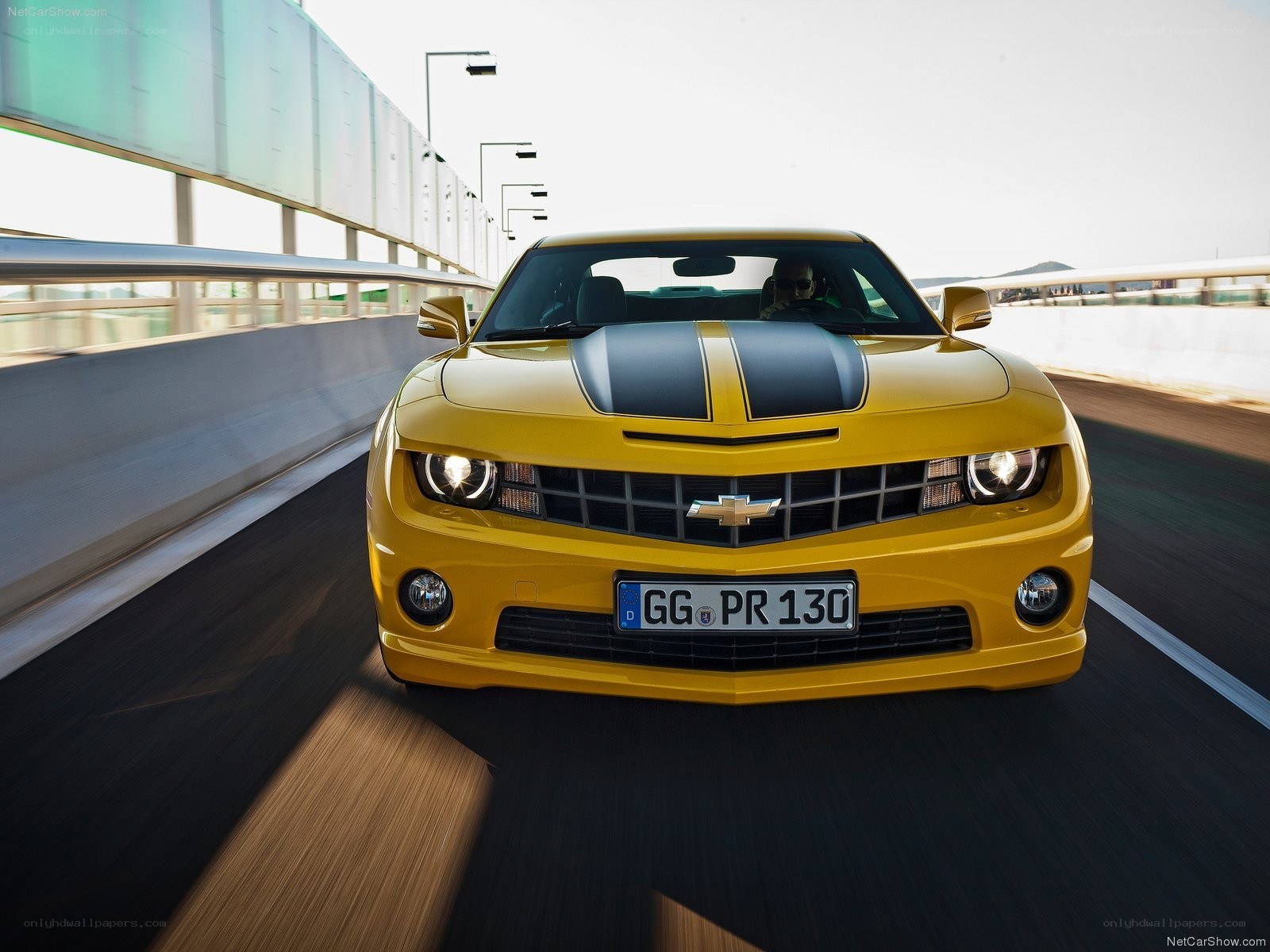 Yellow Camaro on a highway