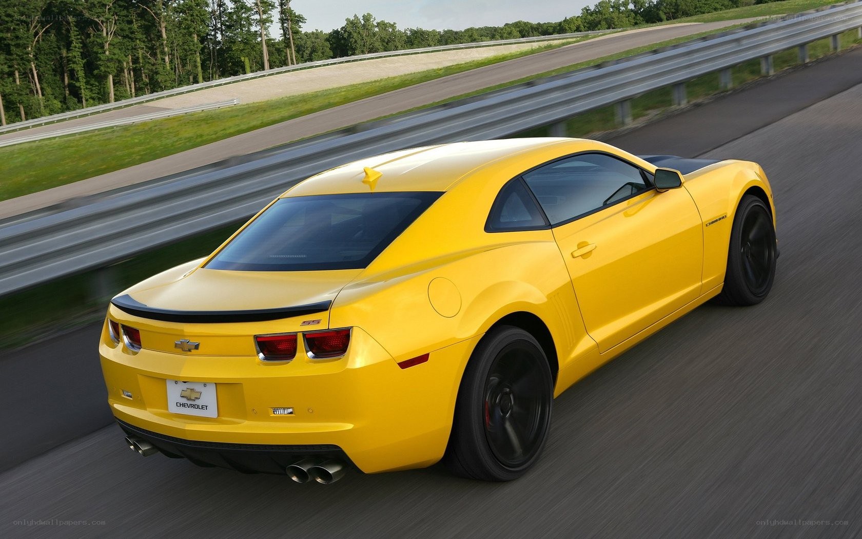 Yellow Camaro on a racetrack