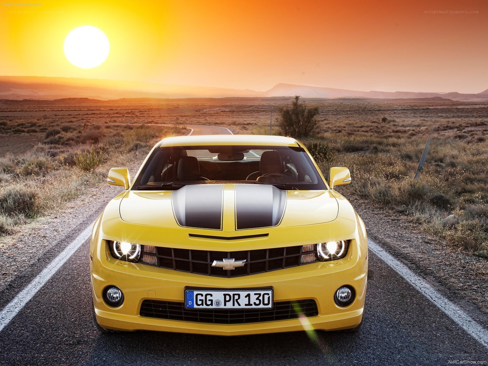 Yellow Camaro on desert road