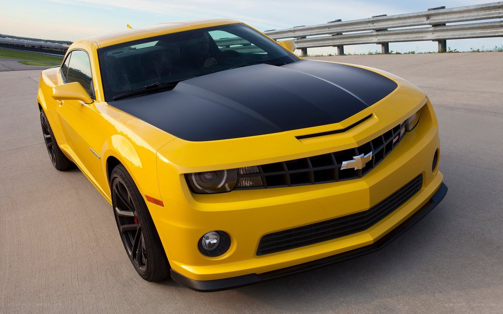 yellow camaro on racetrack