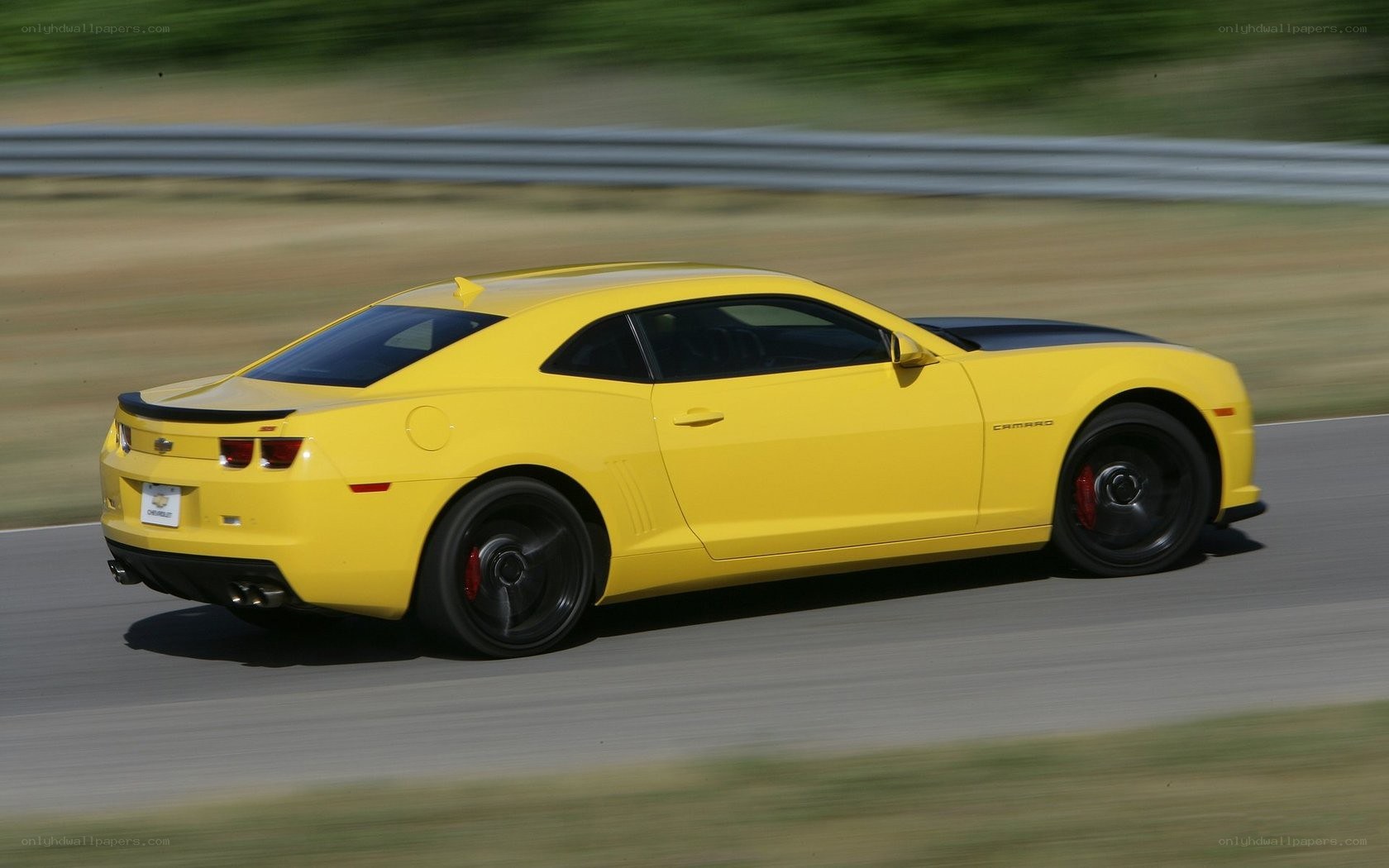 yellow camaro on racetrack