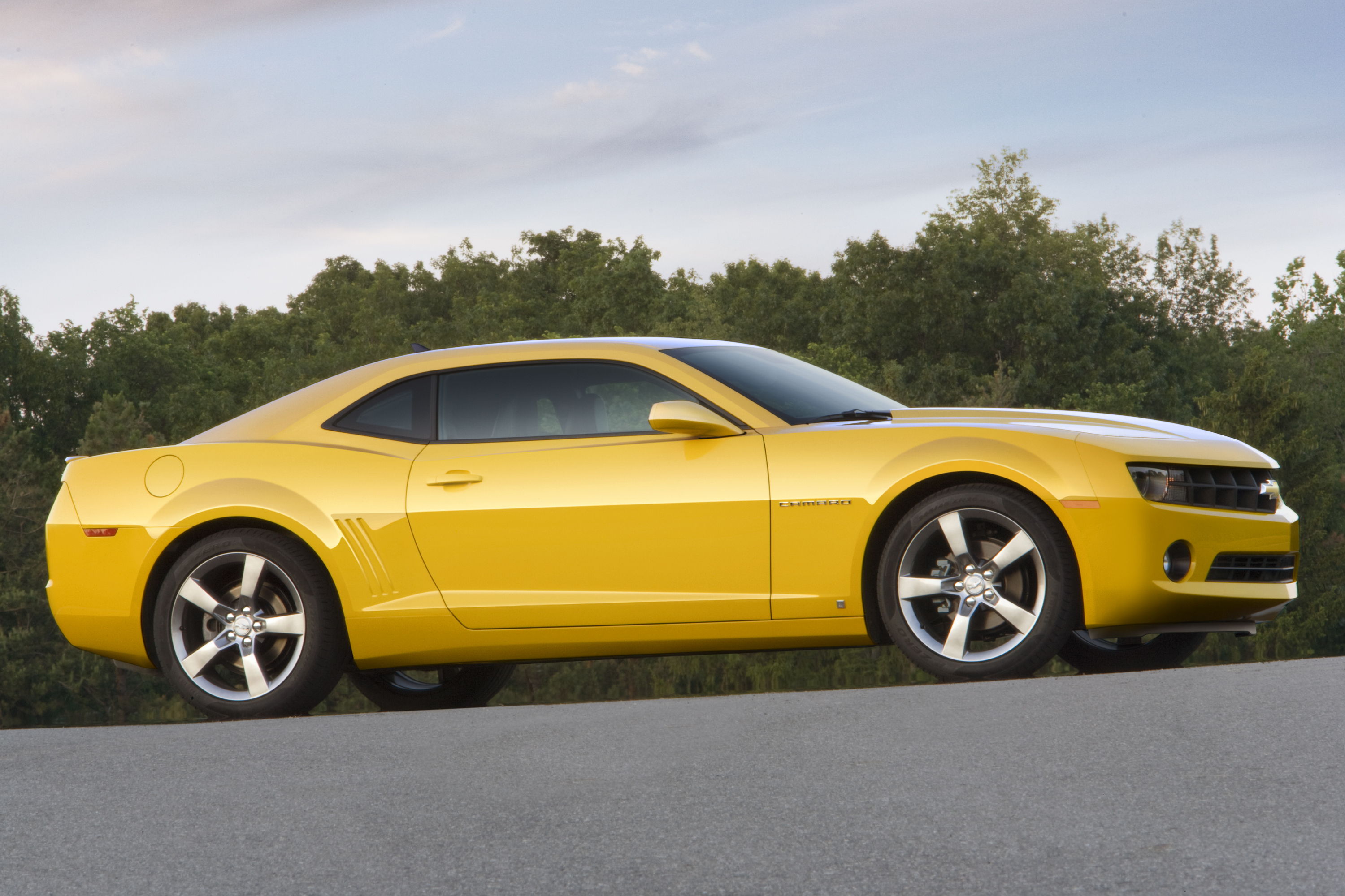 Yellow Camaro on road
