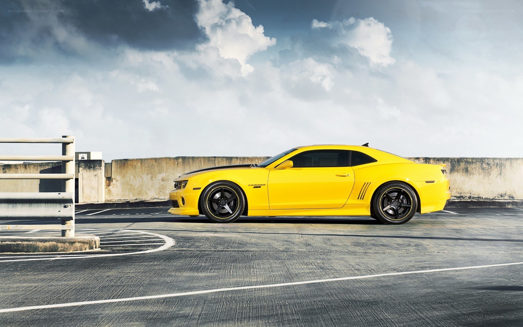 yellow camaro on rooftop