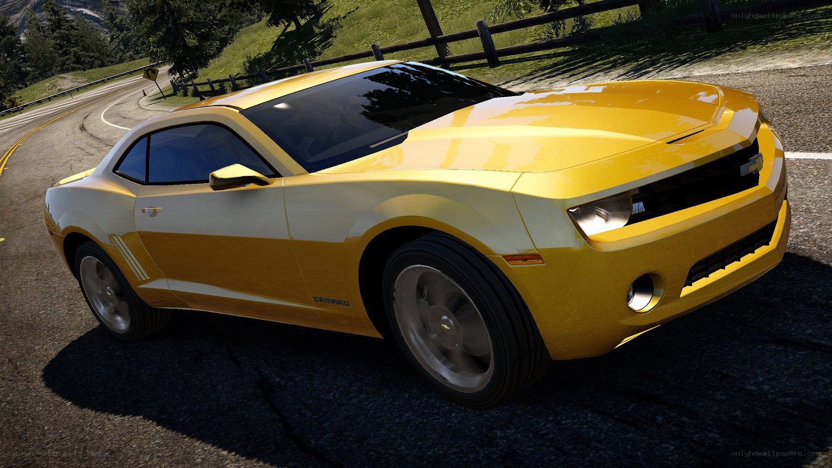 yellow camaro on winding road