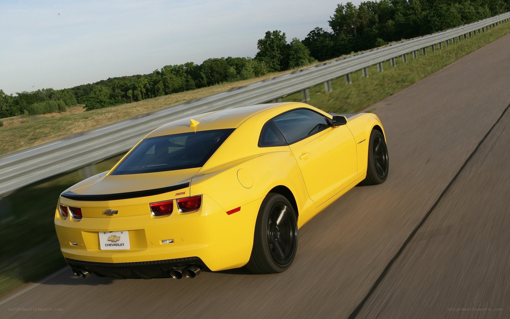 Yellow Camaro SS on a road