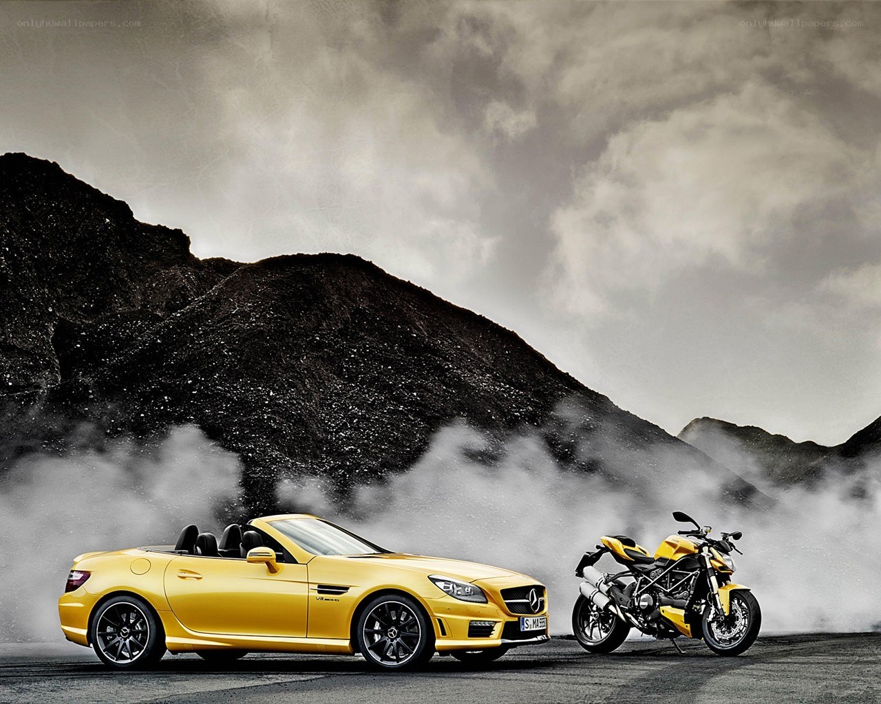 Yellow car and motorcycle