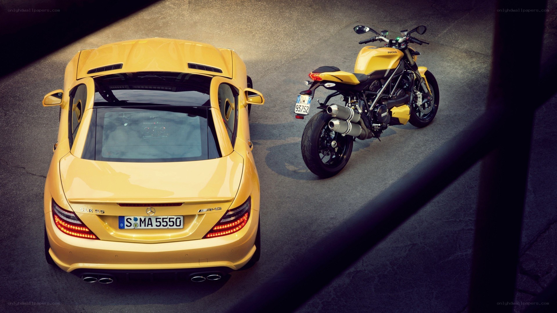 Yellow car and motorcycle