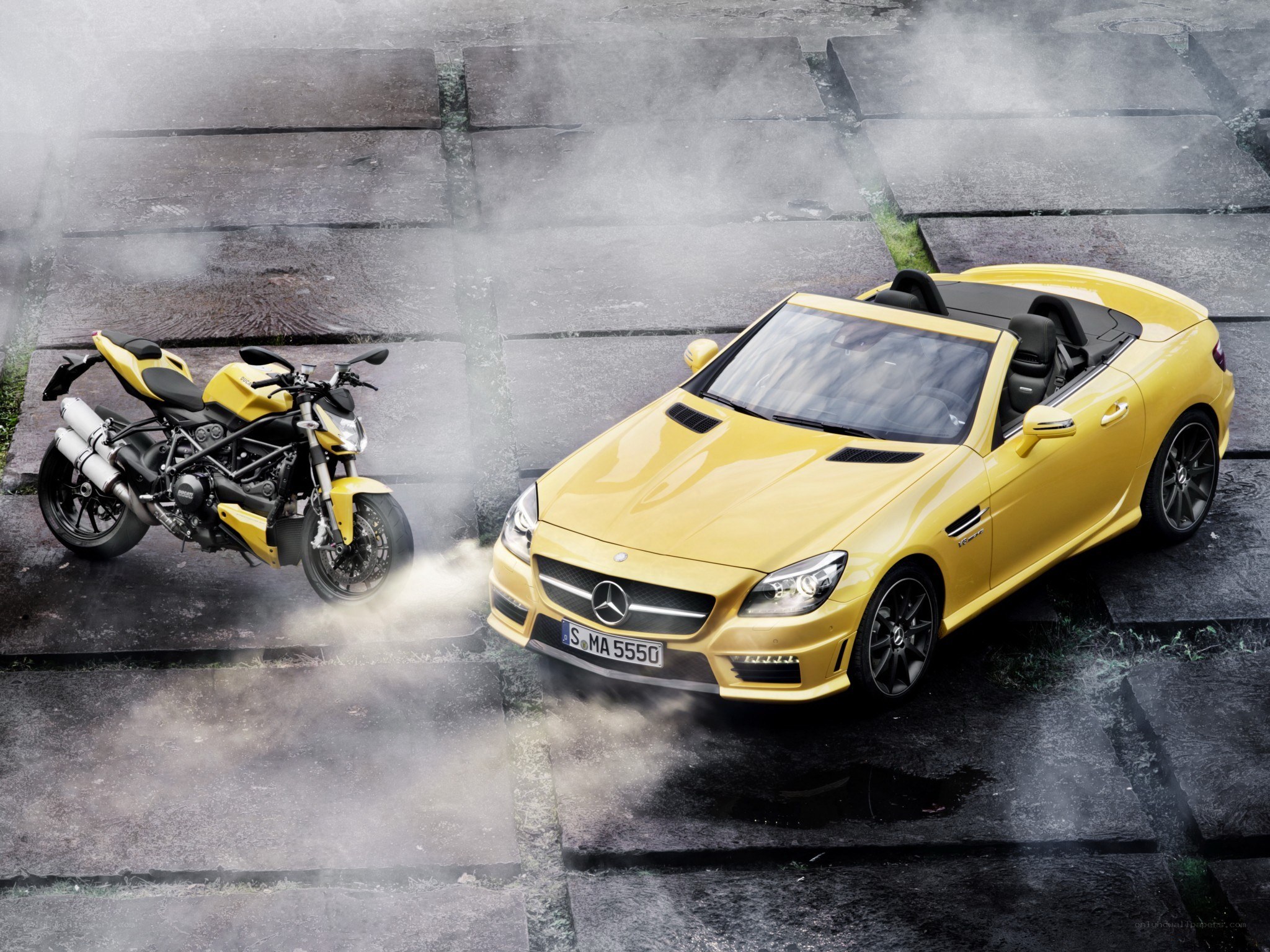 Yellow car and motorcycle