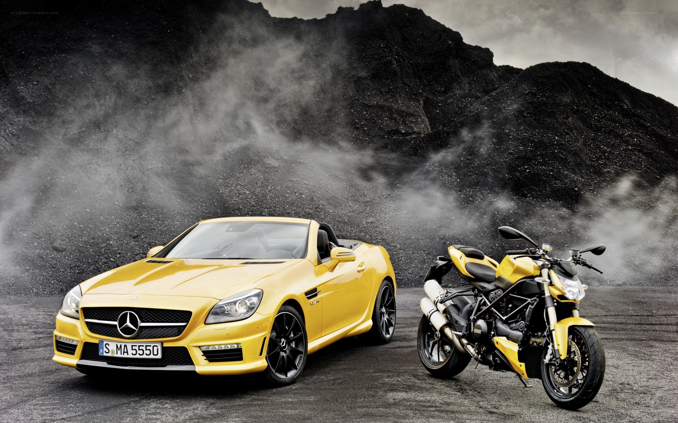 Yellow car and motorcycle