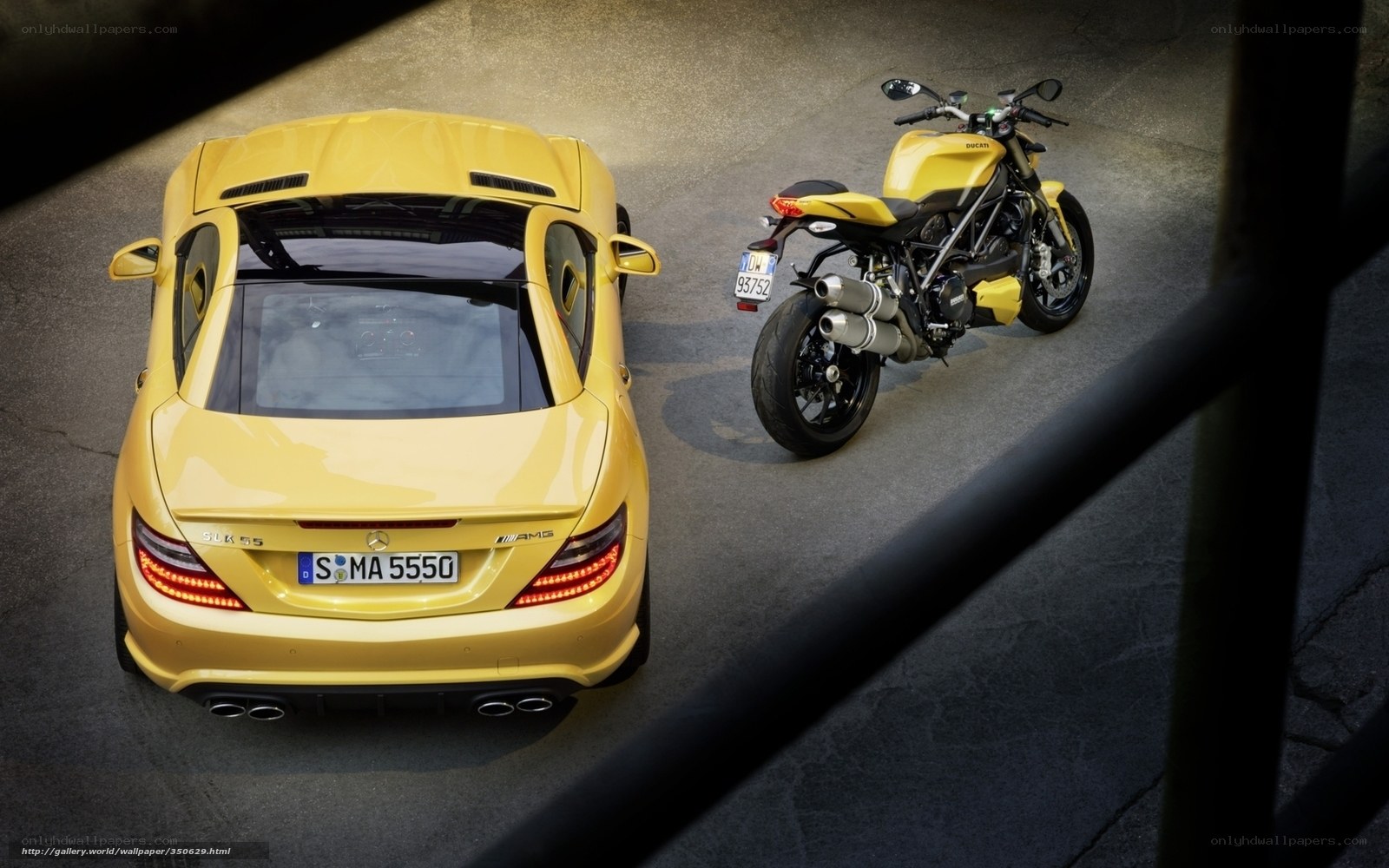 Yellow car and motorcycle