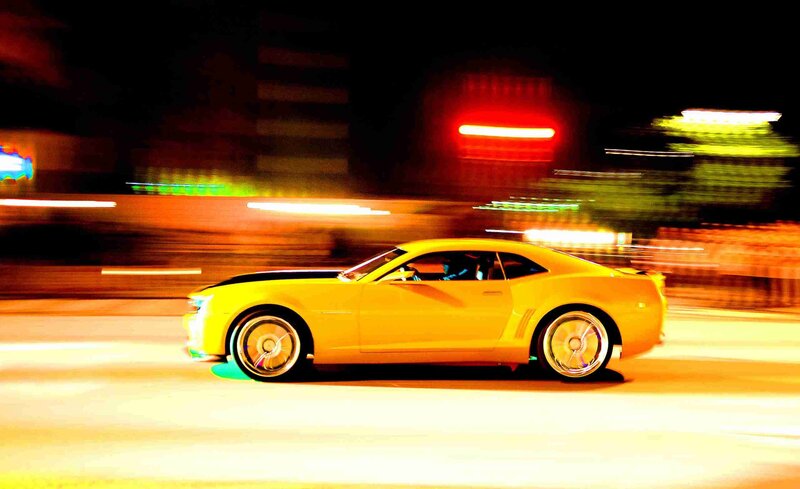 Yellow car at night with motion blur