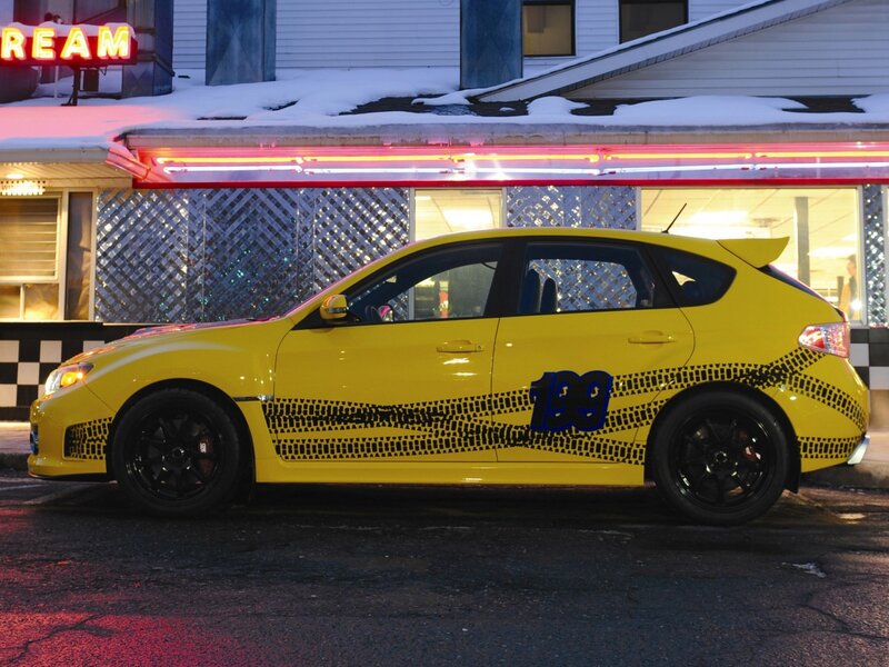yellow car at night with neon lights