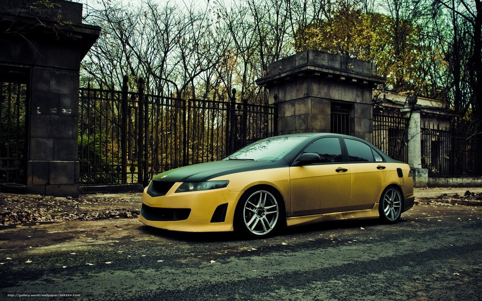 yellow car at old gate