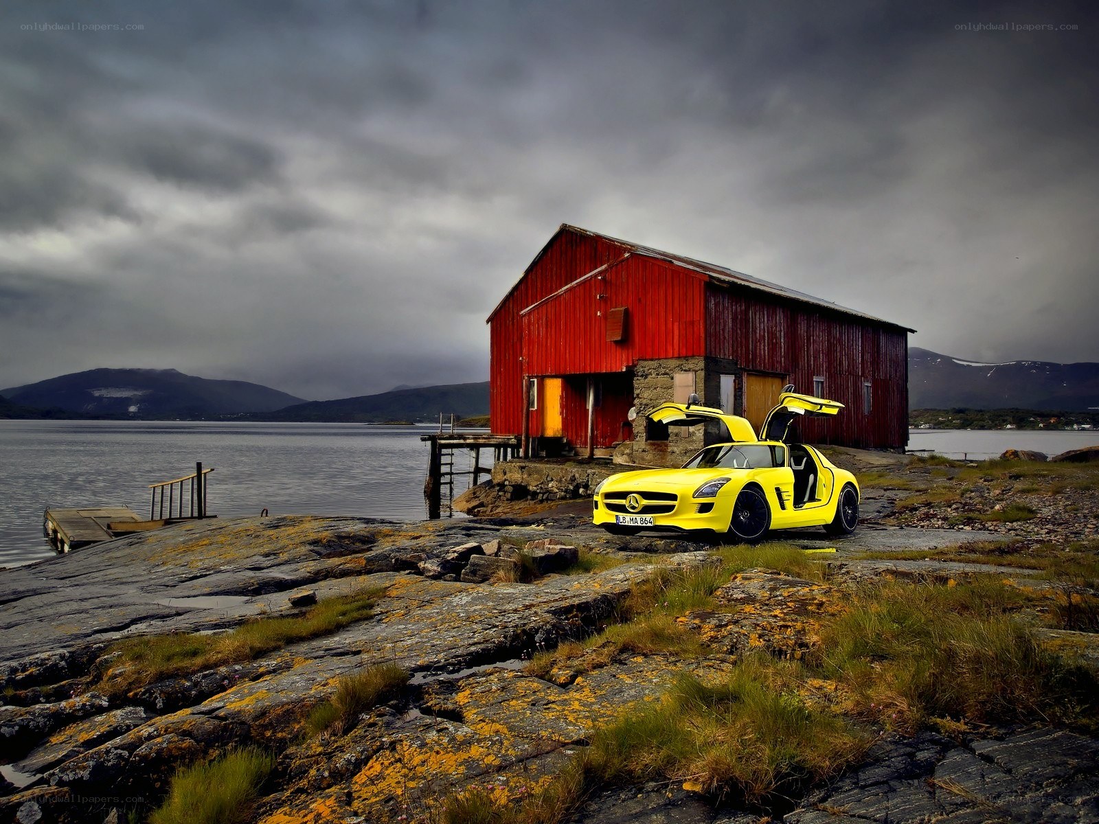 Yellow car at red barn
